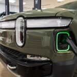 Rivian electric vehicles at Olive-Harvey College for the EV Technician Apprenticeship Program, showcasing hands-on training in electric car repair.