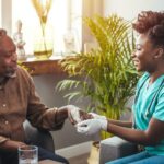 A palliative care specialist visits a patient at home as part of a home-based palliative care program.