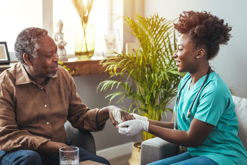 A palliative care specialist visits a patient at home as part of a home-based palliative care program.