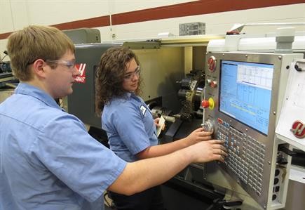 Students working on CNC machines