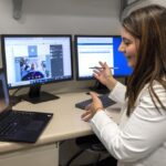 Dr. Kamia Thakur conducts a virtual consultation with Mildred Shelly as part of a home recovery care program, showcasing telehealth in patient care.