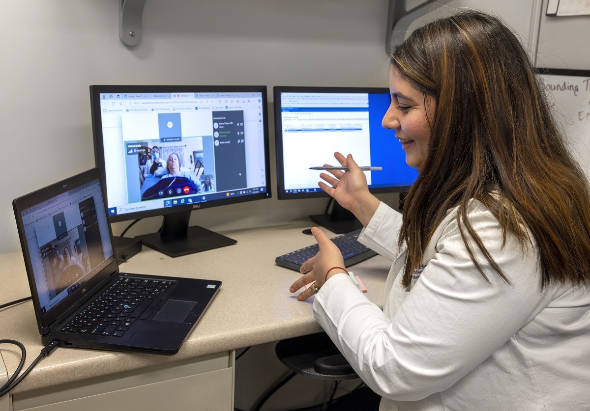 Dr. Kamia Thakur conducts a virtual consultation with Mildred Shelly as part of a home recovery care program, showcasing telehealth in patient care.