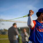 Baseball Factory athlete performing Jaeger J-Bands arm care exercises as part of the Jaeger Arm Care Program partnership