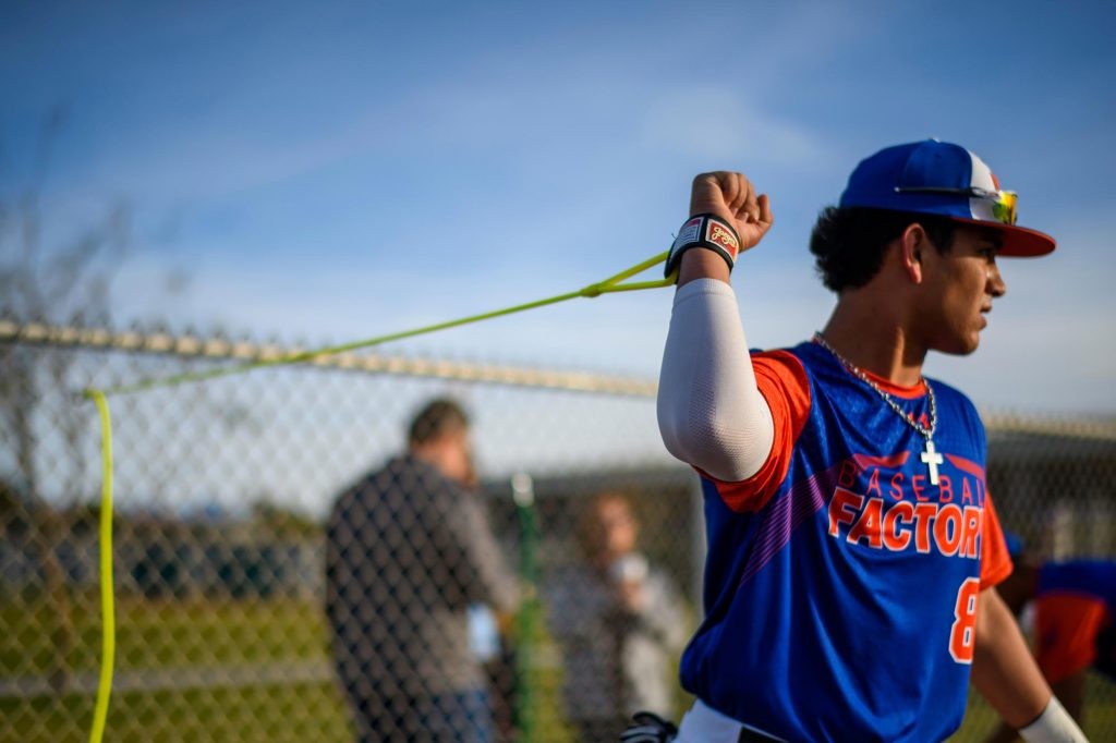 Baseball Factory athlete performing Jaeger J-Bands arm care exercises as part of the Jaeger Arm Care Program partnership